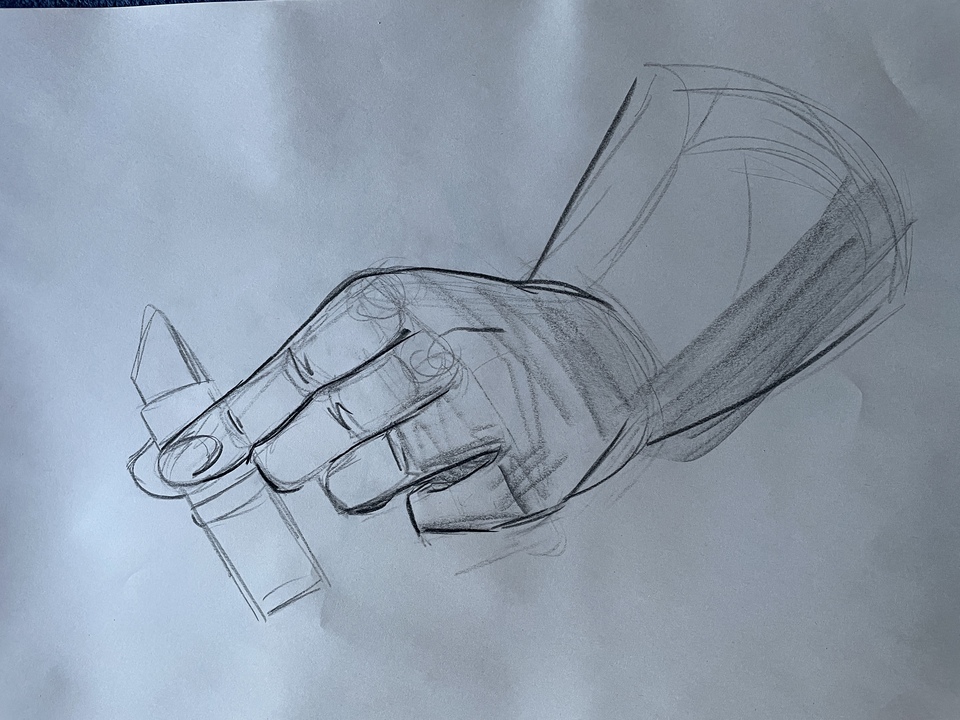 Hand holding lipstick